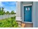 This home welcomes you with a gorgeous blue front door and a beautiful stone and tiled porch at 3228 Bryant Park Dr, New Port Richey, FL 34655
