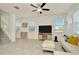 Bright and airy living room showcasing staircase, neutral walls and decor, and tons of natural light at 3228 Bryant Park Dr, New Port Richey, FL 34655