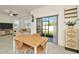 Bright living area with modern decor, ceiling fan, tile floors, and sliding glass doors to the backyard at 3228 Bryant Park Dr, New Port Richey, FL 34655