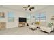 Inviting living room featuring a plush white couch, modern furniture, and lots of natural light at 3228 Bryant Park Dr, New Port Richey, FL 34655