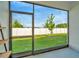 Screened patio with a view of the backyard and new landscaping at 3228 Bryant Park Dr, New Port Richey, FL 34655