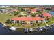 Aerial view of waterfront residences with private boat docks and red tile roofs at 3334 Purple Martin Dr # 212, Punta Gorda, FL 33950