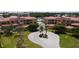 Community aerial view showing the manicured landscaping, multiple buildings, and waterfront at 3334 Purple Martin Dr # 212, Punta Gorda, FL 33950