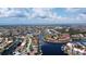 Overhead view of a waterfront neighborhood showcasing homes, canals, lush greenery, and access to the ocean at 3334 Purple Martin Dr # 212, Punta Gorda, FL 33950