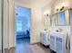 Bathroom with double sinks that provides entry to the bedroom at 3334 Purple Martin Dr # 212, Punta Gorda, FL 33950