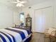 Bedroom featuring a full bed, closet, and chair, with wood-look flooring at 3334 Purple Martin Dr # 212, Punta Gorda, FL 33950