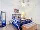 Bedroom featuring a full bed, wood-look floors, and ceiling fan at 3334 Purple Martin Dr # 212, Punta Gorda, FL 33950