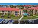 Exterior view showcasing a pool, docks, lush landscaping, and inviting residences at 3334 Purple Martin Dr # 212, Punta Gorda, FL 33950