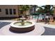 Three-tiered water fountain surrounded by lush landscaping and manicured grounds at 3334 Purple Martin Dr # 212, Punta Gorda, FL 33950