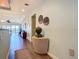 Hallway featuring decorative wall art and furnishings, seamlessly flowing into the living area at 3334 Purple Martin Dr # 212, Punta Gorda, FL 33950