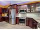 Modern kitchen featuring stainless steel appliances, granite countertops and updated backsplash at 3334 Purple Martin Dr # 212, Punta Gorda, FL 33950