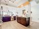 Spacious kitchen area with a center island, dark wood cabinetry, and stainless steel appliances at 3334 Purple Martin Dr # 212, Punta Gorda, FL 33950
