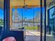 Enjoy waterfront views from this inviting lanai with comfortable seating and a ceiling fan for outdoor relaxation at 3334 Purple Martin Dr # 212, Punta Gorda, FL 33950