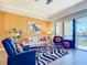 Stylish living room featuring modern decor, tile floors, and plenty of natural light at 3334 Purple Martin Dr # 212, Punta Gorda, FL 33950