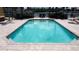 Rectangular pool with brick border and tiled deck in a waterfront community at 3334 Purple Martin Dr # 212, Punta Gorda, FL 33950