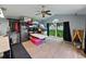 Spacious bonus room with vaulted ceilings, natural light, and ceiling fan at 3909 Valrico Grove Dr, Valrico, FL 33594
