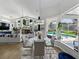 Inviting open-concept living space with a pool view, fireplace, and elegant dining area at 3909 Valrico Grove Dr, Valrico, FL 33594