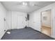 Spacious carpeted basement with white walls and multiple access doors at 4230 Indianapolis Ne St, St Petersburg, FL 33703