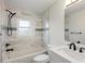 Bathroom with modern fixtures, featuring a tub and shower combination and a stylish vanity at 4230 Indianapolis Ne St, St Petersburg, FL 33703