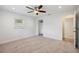 Bedroom boasts a closet for storage, natural lighting, and a ceiling fan for comfortable living at 4230 Indianapolis Ne St, St Petersburg, FL 33703