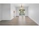 Bright dining room with wood-look tile and sliding glass doors leading to the pool area at 4230 Indianapolis Ne St, St Petersburg, FL 33703
