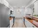 Modern kitchen with stainless steel appliances, granite countertops, and bright white cabinetry at 4230 Indianapolis Ne St, St Petersburg, FL 33703