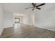 Spacious living room featuring sleek, wood-look tile and abundant natural light at 4230 Indianapolis Ne St, St Petersburg, FL 33703