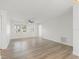 Bright living room featuring wood-look flooring, neutral paint and ample room for furnishings at 4230 Indianapolis Ne St, St Petersburg, FL 33703