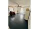 Bedroom featuring dark wood flooring, white walls, a ceiling fan, and large windows at 439 Corbett Rd, Lithia, FL 33547