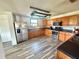 Well-equipped kitchen featuring stainless steel appliances and abundant oak cabinets at 439 Corbett Rd, Lithia, FL 33547