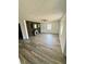 Cozy living room featuring stylish wood-look flooring, a ceiling fan, and a decorative fireplace at 439 Corbett Rd, Lithia, FL 33547