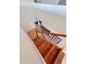 A wooden staircase with a white banister leads to the lower level at 439 Corbett Rd, Lithia, FL 33547