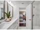 Bright bathroom with double vanity, modern fixtures, and a view of the main bedroom for added convenience at 4511 S Manhattan Ave # 11, Tampa, FL 33611