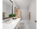 Bright bathroom featuring white cabinetry, marble floors, and shower/tub combo at 4511 S Manhattan Ave # 11, Tampa, FL 33611