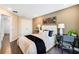 Bright bedroom featuring neutral colors, a large window, and hardwood floors at 4511 S Manhattan Ave # 11, Tampa, FL 33611