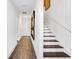 Hallway features a stairwell with hardwood floors and modern design at 4511 S Manhattan Ave # 11, Tampa, FL 33611