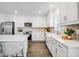 Bright kitchen features stainless steel appliances, an island with chairs, and stylish cabinetry at 4511 S Manhattan Ave # 11, Tampa, FL 33611