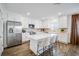 Bright kitchen features stainless steel appliances, an island with chairs, and stylish cabinetry at 4511 S Manhattan Ave # 11, Tampa, FL 33611
