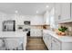 Bright kitchen features stainless steel appliances, an island with chairs, and stylish cabinetry at 4511 S Manhattan Ave # 11, Tampa, FL 33611