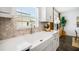 A farm-style kitchen sink offers views from the window and stylish backsplash at 4511 S Manhattan Ave # 11, Tampa, FL 33611