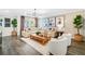 This living room has a big couch and coffee table with big window in the back at 4511 S Manhattan Ave # 11, Tampa, FL 33611