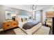 Stylish main bedroom with a luxurious bed, chic nightstands, elegant lighting, and a large window for ample natural light at 4511 S Manhattan Ave # 11, Tampa, FL 33611