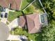 An aerial view of the property showcasing the house, driveway, and a screened-in pool area at 4750 Augusta Ave, Oldsmar, FL 34677
