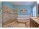 Modern bathroom featuring a glass shower and a soaking tub with claw feet, complemented by neutral tile at 4750 Augusta Ave, Oldsmar, FL 34677