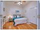 Cozy bedroom featuring hardwood floors, a ceiling fan, and a serene coastal style at 4750 Augusta Ave, Oldsmar, FL 34677