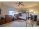 Bedroom featuring bunk beds, carpet, a desk, and a ceiling fan at 4750 Augusta Ave, Oldsmar, FL 34677