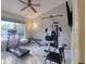 Bright exercise room with a treadmill, stationary bike, and weightlifting machine at 4750 Augusta Ave, Oldsmar, FL 34677