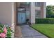 Charming home entrance featuring double doors, stone walkway and beautiful landscaping at 4750 Augusta Ave, Oldsmar, FL 34677