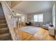 Bright living room features hardwood floors, staircase, and neutral paint colors at 4750 Augusta Ave, Oldsmar, FL 34677