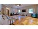 Relaxing living room showcasing hardwood floors, a ceiling fan, and sliders to the lanai at 4750 Augusta Ave, Oldsmar, FL 34677